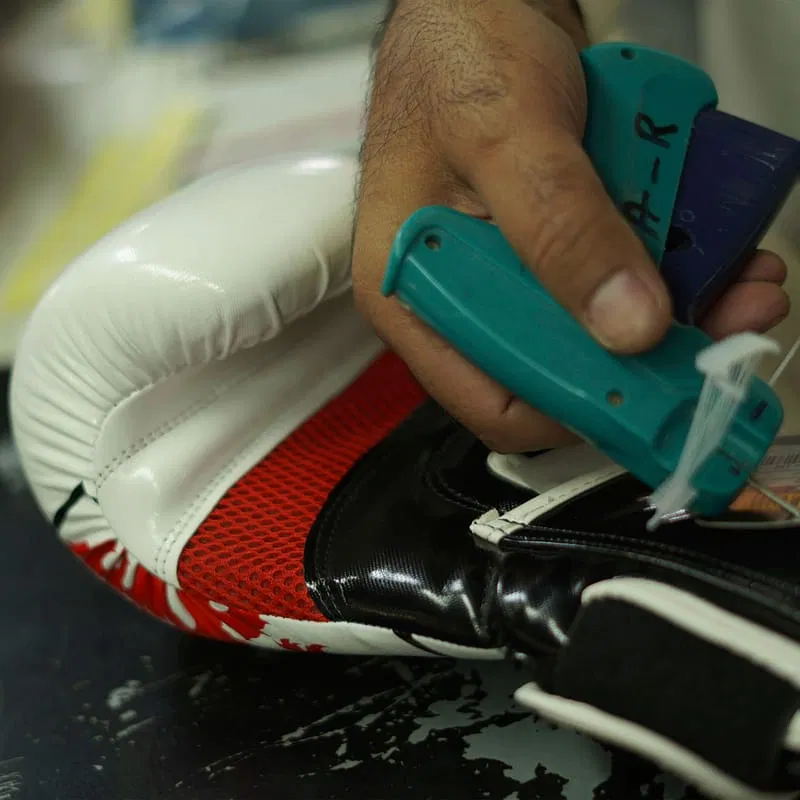 Boxing glove quality-control inspection at Rainwolf Sports
