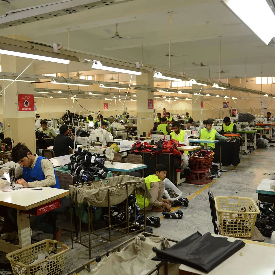 Hand stitching of combat sports equipment in Sialkot, Pakistan